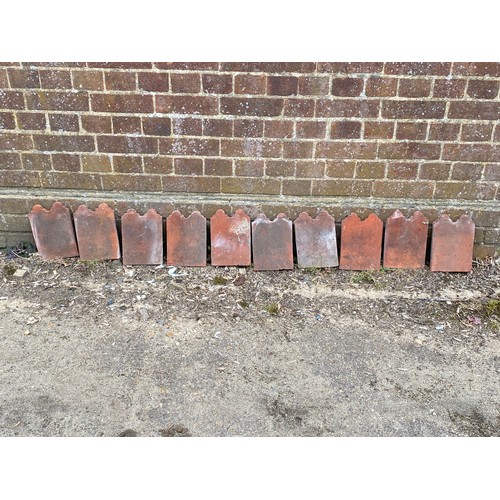 134 - QUANTITY OF TERRACOTTA EDGED TILES 
23CM