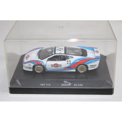 370 - 3 X RACING CARS IN DISPLAY BOXES 
JAG - FERRARI AND NISSAN