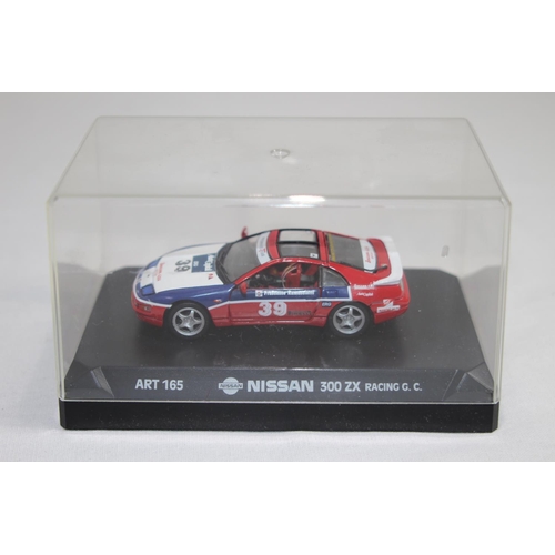 370 - 3 X RACING CARS IN DISPLAY BOXES 
JAG - FERRARI AND NISSAN