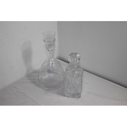 152 - 2 X DECANTERS AND SILVER HANDLE CARAFE 
30CM