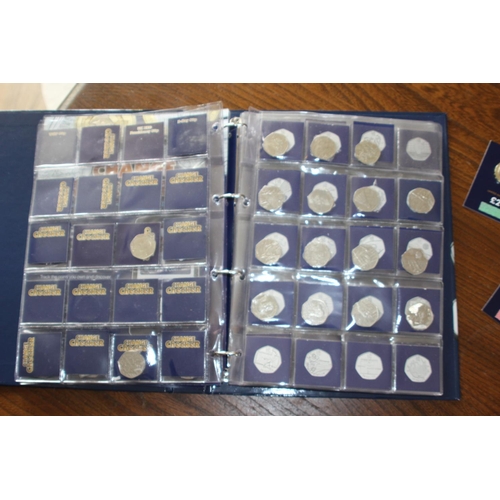 988 - CHANGE CHECKER COIN FOLDER WITH OVER £100 OF 50P, £1 AND £2 COINS