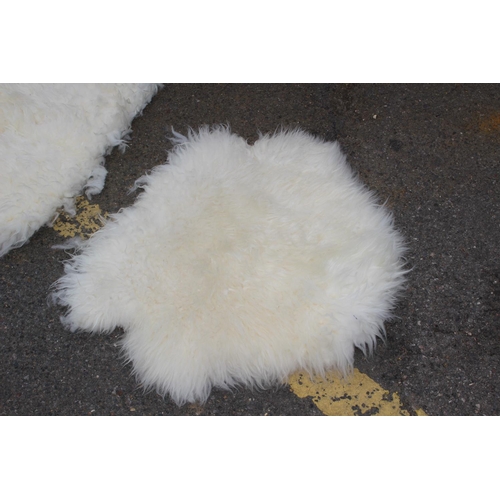 106 - 2 X SMALL SHEEP SKIN RUGS 
69 X 56CM