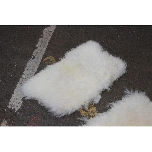 106 - 2 X SMALL SHEEP SKIN RUGS 
69 X 56CM