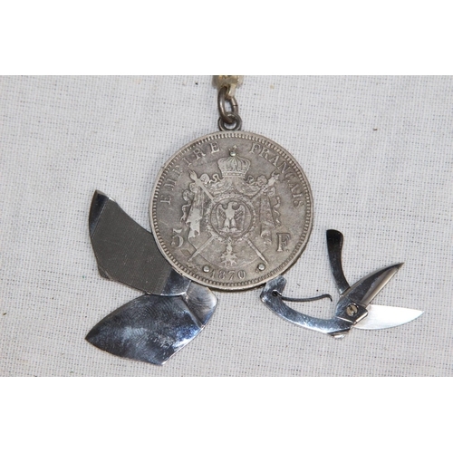 926 - VINTAGE NOVELTY TOOL COIN WITH SILVER CHAIN