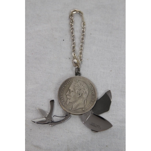 926 - VINTAGE NOVELTY TOOL COIN WITH SILVER CHAIN