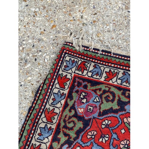 121 - VINTAGE EASTERN RUG
110 X 85CM