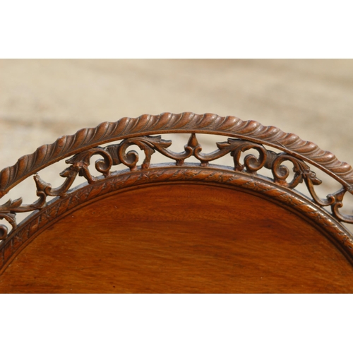 95 - ETHNIC CARVED TILT TOP TABLE ON TRIPOD FEET
70 X 70CM