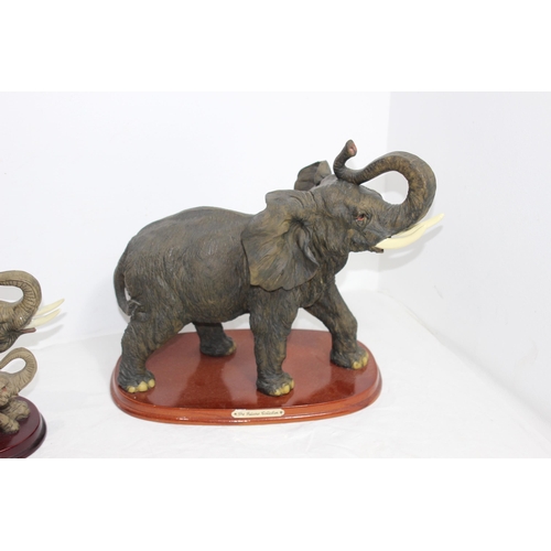 292 - THE JULIANA COLLECTION AND THE CROSA COLLECTION ELEPHANT FIGURES ON PLINTHS 
37 X 33CM