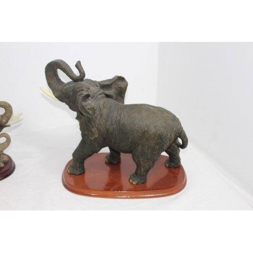 292 - THE JULIANA COLLECTION AND THE CROSA COLLECTION ELEPHANT FIGURES ON PLINTHS 
37 X 33CM