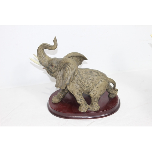 292 - THE JULIANA COLLECTION AND THE CROSA COLLECTION ELEPHANT FIGURES ON PLINTHS 
37 X 33CM