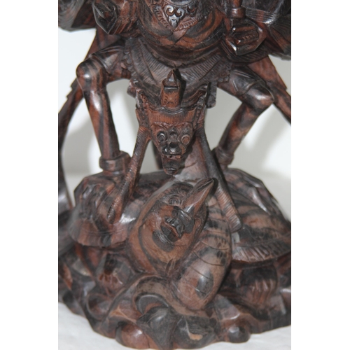 384 - EASTERN DEITY WOODEN CARVING