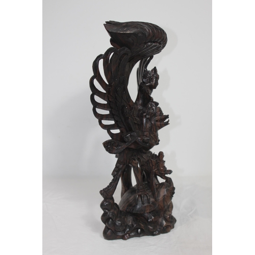 384 - EASTERN DEITY WOODEN CARVING