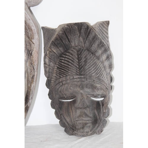 396 - QUANTITY OF VINTAGE HANDCARVED MASKS 
37CM