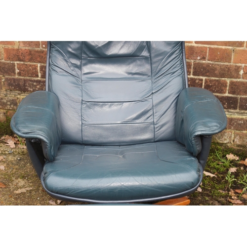 52 - LEATHER ARMCHAIR AND FOOTSTOOL