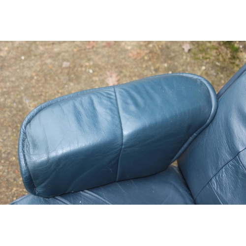 52 - LEATHER ARMCHAIR AND FOOTSTOOL