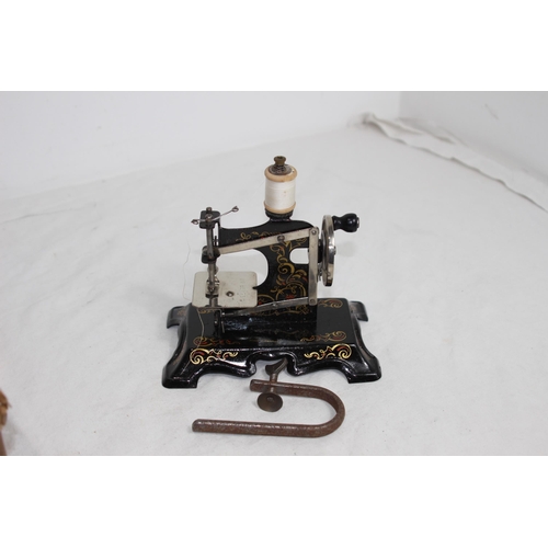 293A - ANTIQUE BOXED GERMAN CHILDS SEWING MACHINE
15 X 15CM