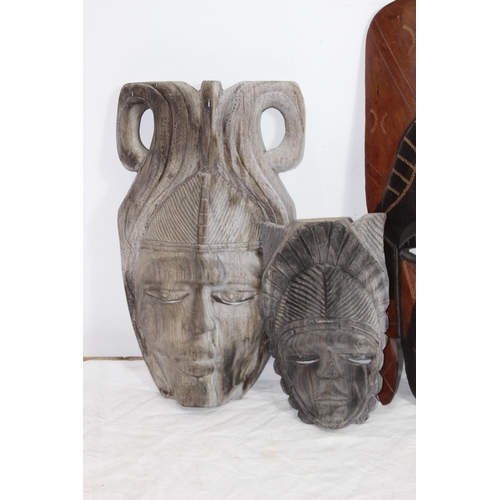 396 - QUANTITY OF VINTAGE HANDCARVED MASKS 
37CM