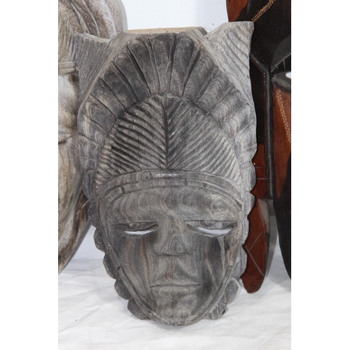 396 - QUANTITY OF VINTAGE HANDCARVED MASKS 
37CM