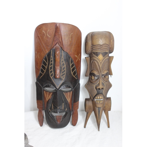 396 - QUANTITY OF VINTAGE HANDCARVED MASKS 
37CM