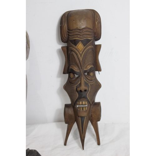 396 - QUANTITY OF VINTAGE HANDCARVED MASKS 
37CM