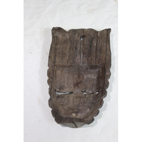 396 - QUANTITY OF VINTAGE HANDCARVED MASKS 
37CM