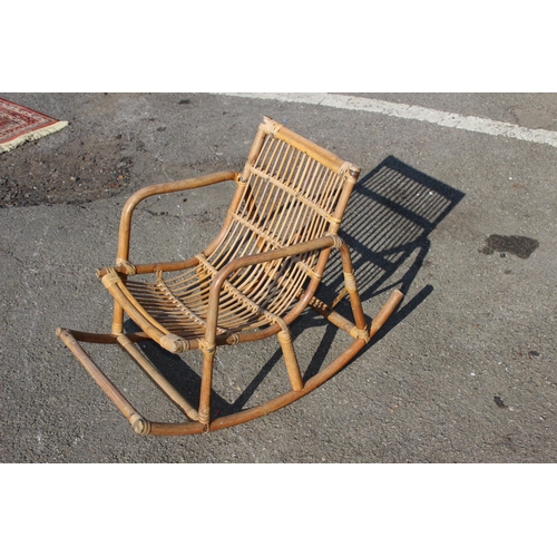 44 - VINTAGE CHILDS BAMBOO AND WICKER ROCKING CHAIR 
39 X 70 X 50CM