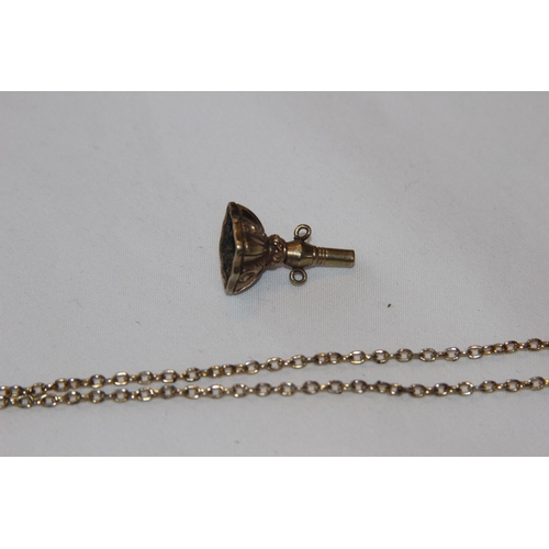 800 - 19TH CENTURY GILT METAL FOB WATCH KEY AND A YELLOW METAL CHAIN