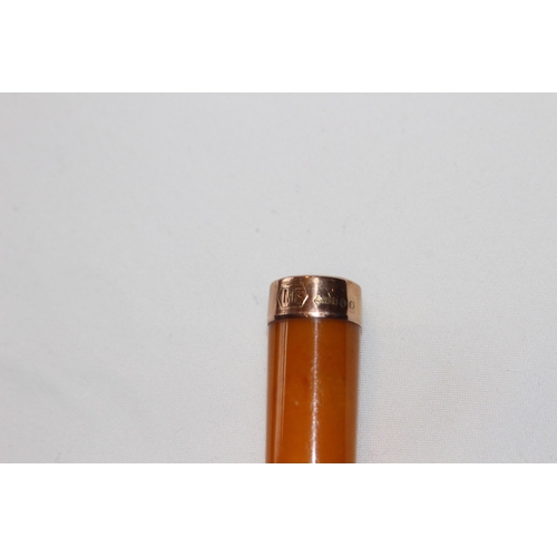 801 - CASED 9CT GOLD MOUNTED BLONDE AMBER CHEROOT HOLDER - LONDON 1911