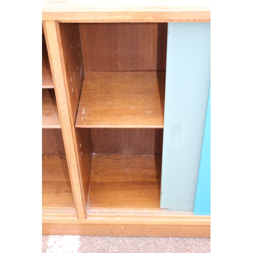 46 - 2 X RETRO PAINTED GLASS BOOKCASES 
137 X 29 X 78CM