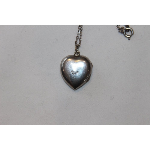 684 - SILVER HEART SHAPED LOCKET AND SILVER CHAIN TO HOLD TWO PHOTOS