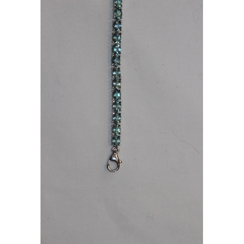 688 - SILVER BRACELET WITH AQUA COLOURED STONES