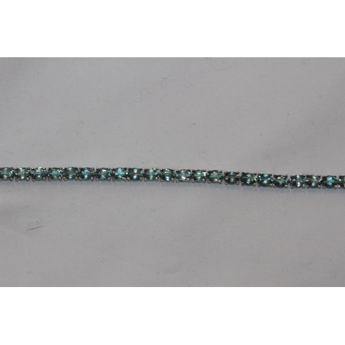 688 - SILVER BRACELET WITH AQUA COLOURED STONES