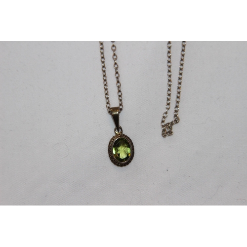 695 - PERIDOT COLOURED STONE SET GILT SILVER PENDANT AND SILVER CHAIN