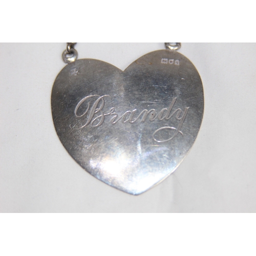 740 - HEART SHAPED LARGE SILVER DECANTER LABEL FOR BRANDY - LONDON 1911 BY W AND G NEAL