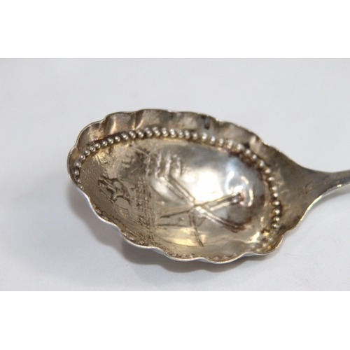 730 - DUTCH SILER WINE OR CADDY SPOON WITH WINDMILL DECORATION TO BOWL AND AN ARCHER ON THE STEM