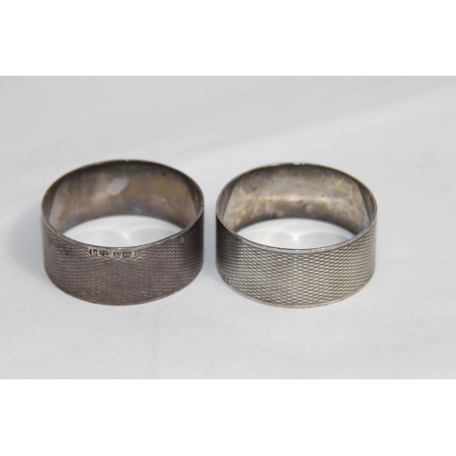 752 - PAIR OF ROUND SILVER NAPKIN RINGS WITH ENGINE TURNED FINISH - VACANT CARTOUCHES - BIRMINGHAM 1978