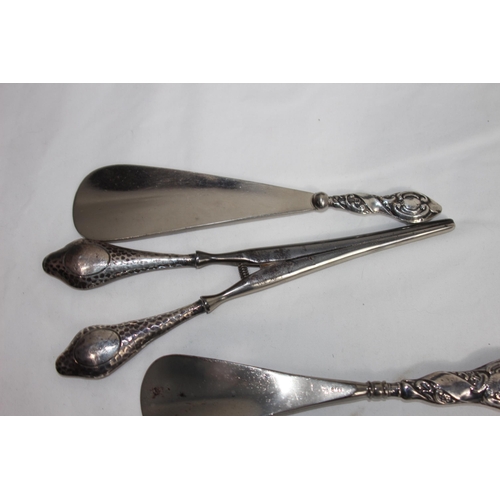 757 - SILVER MOUNTED EBONISED WOODEN DRESSING TABLE TRAY ANS A SELECTION OF SILVER HANDLE SHOE HORNS AND S... 