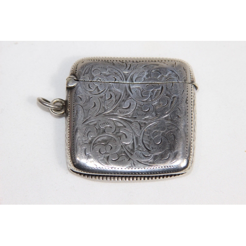 769 - EDWARDIAN LEFT HANDED CURVED BACK SILVER VESTA CASE - BIRMINGHAM 1903