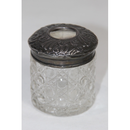 770 - TWO SILVER TOPPED VANITY JARS - BIRMINGHAM 1905 AND 1921