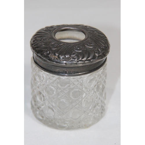 770 - TWO SILVER TOPPED VANITY JARS - BIRMINGHAM 1905 AND 1921