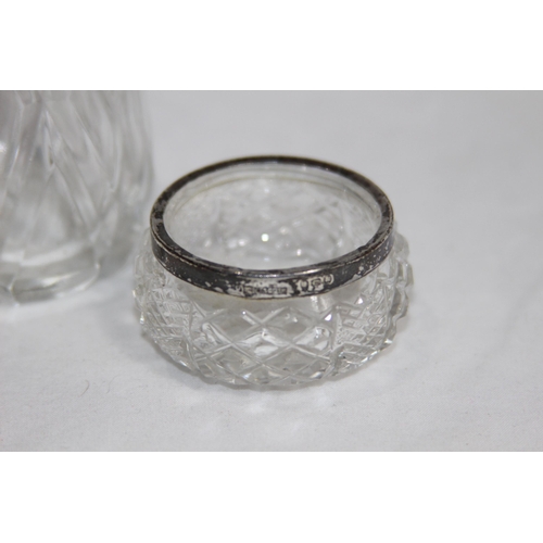 779 - SILVER TOPPED PEPPER POT AND SILVER RIMMED SALT