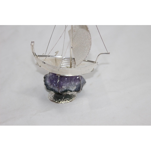 787 - WHITE ITALIAN METAL MODEL OF A BOAT SAT ON A GEODE AMETHYST BASE