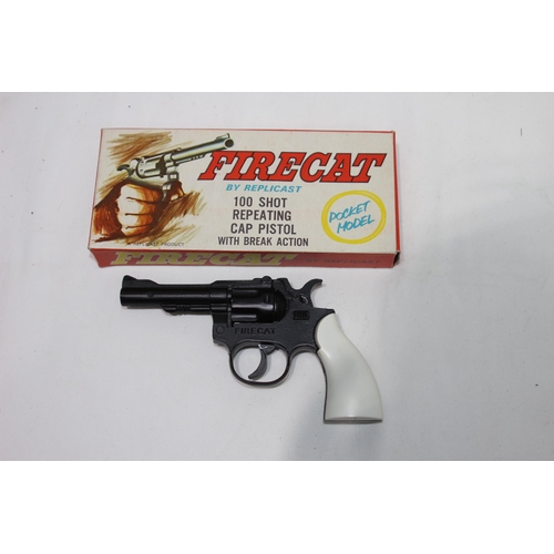 474 - THREE TOY REVOLVER PISTOLS INCLUDING A BOXED AS NEW, FIRECAT POCKET EDITION 100 CAP BY REPLICANT