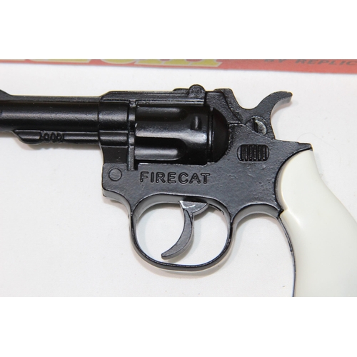 474 - THREE TOY REVOLVER PISTOLS INCLUDING A BOXED AS NEW, FIRECAT POCKET EDITION 100 CAP BY REPLICANT