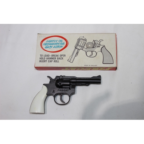 474 - THREE TOY REVOLVER PISTOLS INCLUDING A BOXED AS NEW, FIRECAT POCKET EDITION 100 CAP BY REPLICANT