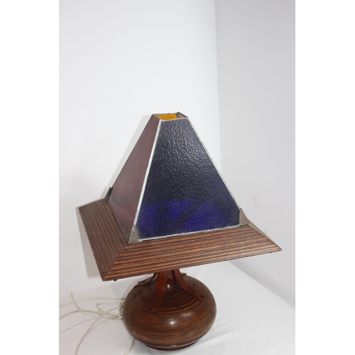 194 - LARGE WOODEN BASED AND FRAMED TABLE LAMP, SHADE MADE FROM 4 DIFFERENT COLOUR LEAD LINED PANELS WITH ... 