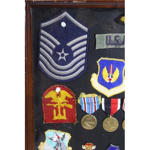 530 - FRAMED COLLECTION OF US MILITARY MEDALS, EMBLEMS, INSIGNIAS AND MIXED BADGES
60 X 46CM