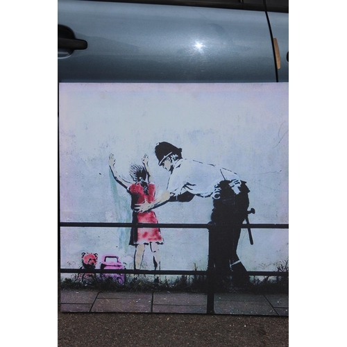 172 - 2 X BANKSY PRINTS ON CANVAS
91 X 66CM