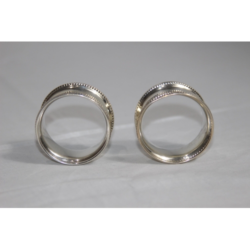 1057 - PAIR OF SILVER NAPKIN RINGS  - S AND CO - BIRMINGHAM 1924 - 19G