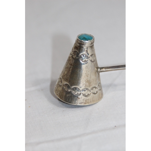 1081 - TURQUOISE MOUNTED SILVER CANDLE SNUFFER WITH NATIVE AMERICAN DESIGN - 23G